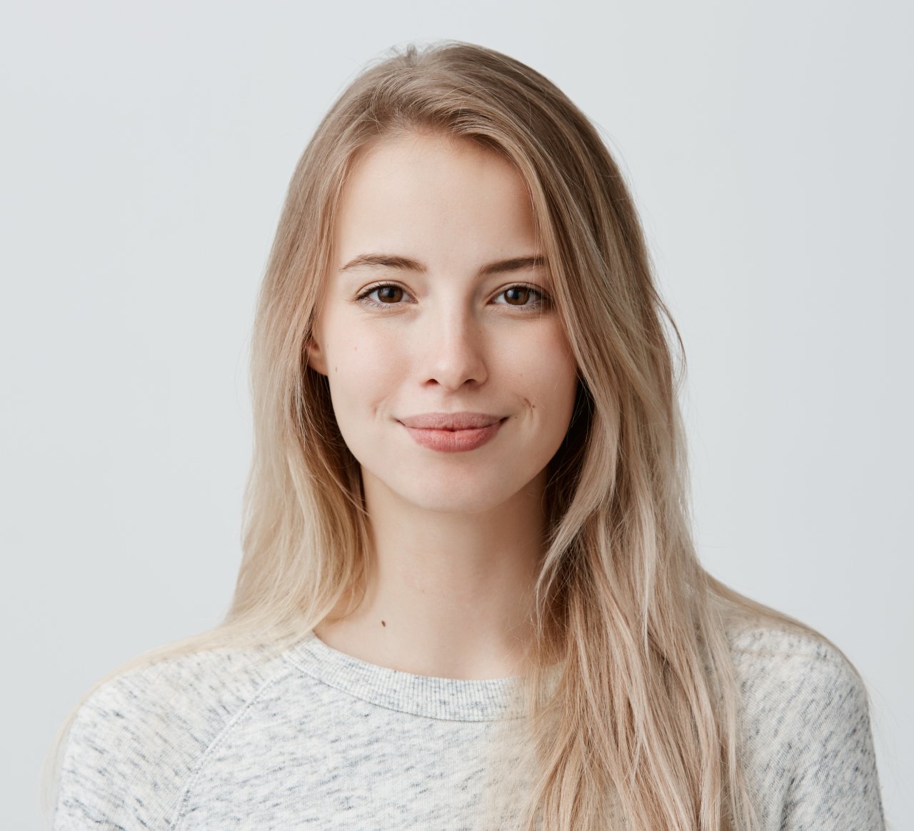 pretty-smiling-joyfully-female-with-fair-hair-dressed-casually-looking-with-satisfaction